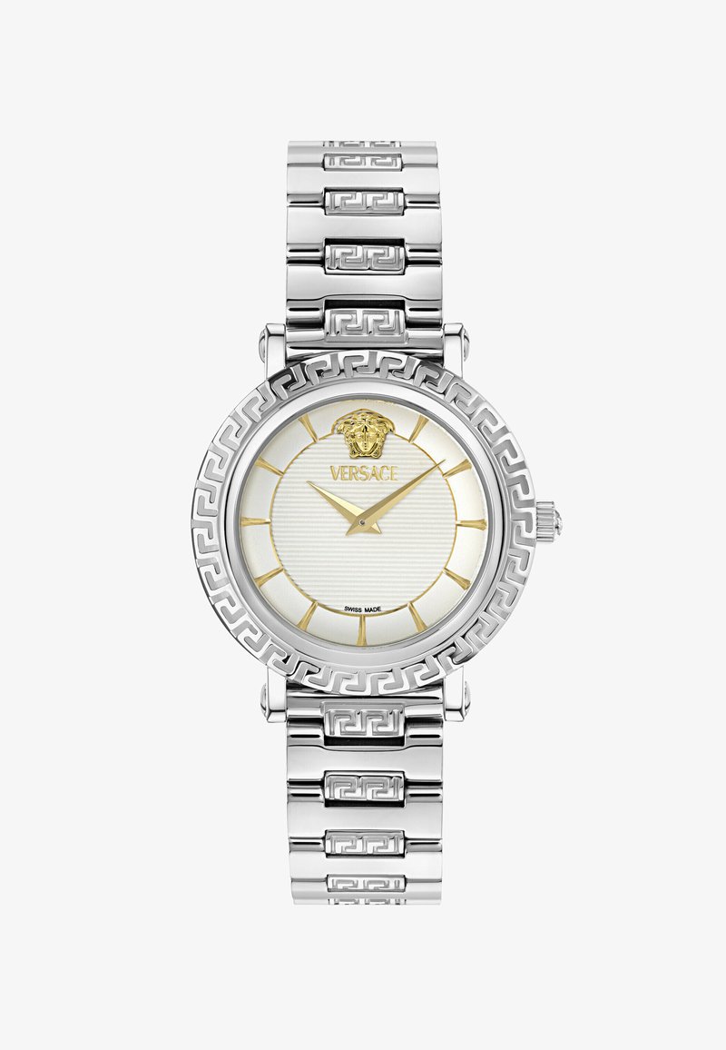 Silberne und goldene Versace-Armbanduhr mit Medusa-Logo, goldenen Stundenmarkierungen und Zeigern sowie einem griechischen Schlüsselmuster auf der Lünette und dem Armband.