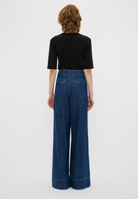 adL PLEATED WIDE LEG  - Wide leg - NAVY BLUE