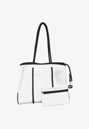 Geantă albă tip tote cu accente negre și motif cu puncte, având două buzunare exterioare cu fermoar și un pouch mai mic detașabil.