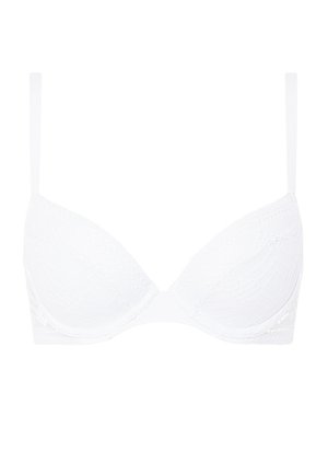 Hvit blonde BH med polstrede kopper, justerbare stropper og en glatt kant. Har teksturerte mønstre på koppene for design detaljer.