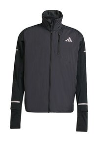 Black long-sleeve sports jacket with front zipper, high collar, zippered chest pocket, and reflective Adidas logo on upper left side.