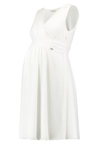 Vit gravidklänning med ärmlös, insvängd design och en strukturerad midja. Tyget är mjukt och faller lätt.