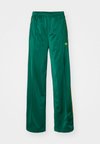 FIREBIRD - Tracksuit bottoms - collegiate green/crew yellow