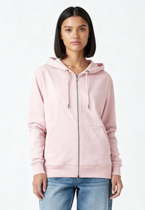 Light pink zip-up hoodie made of soft fabric, featuring a front pouch pocket, drawstrings on the hood, and ribbed cuffs.