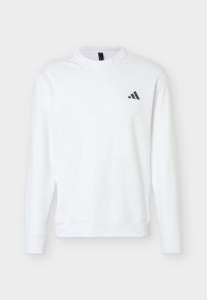 Sweat-shirt blanc à manches longues et col rond avec poignets et ourlet côtelés, présentant un petit logo Adidas noir sur la poitrine gauche.