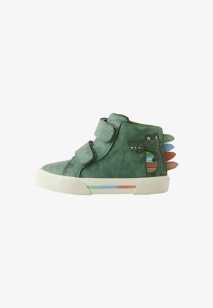 Green leather high-top shoe with Velcro straps, features a crocodile design and colorful spikes on the heel, and a multi-color accent line on the sole.