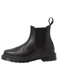 Black Chelsea boots made of smooth leather with elastic side panels, round toe, and textured rubber sole. Features a pull tab at the back.