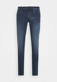 Mörkblå denimjeans med slim fit, som har en klassisk femficksdesign och subtila slitningar framtill.
