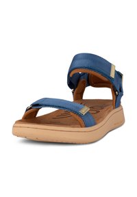 Blue fabric sandal with adjustable straps, tan footbed, and a lightweight beige sole. Features gold accents on strap hardware.