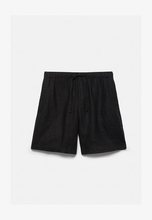 Sorte afslappede shorts med elastisk talje og snøre, lavet af letvægtsstof, lagt fladt på hvid baggrund.