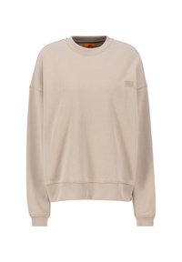 Sudadera beige de tejido suave, con un escote redondo, hombros caídos y un sutil parche con logo en el pecho.