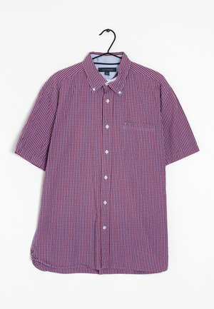 Short-sleeve button-up shirt with red and blue checkered pattern, buttoned collar, front pocket, hanging on black hanger.
