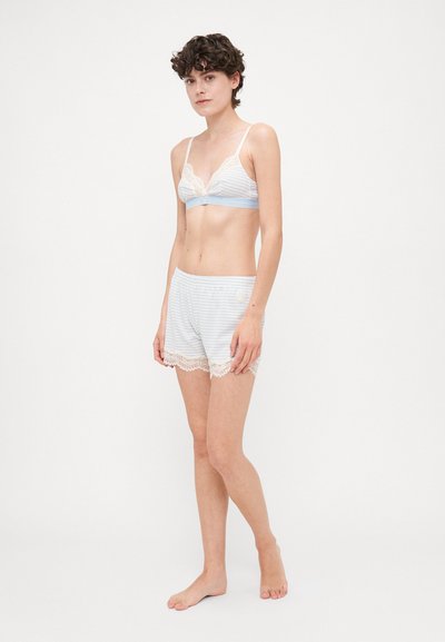 Light blue and white striped bralette with lace trim, paired with matching shorts featuring lace accents at the hem. Both made from soft fabric.