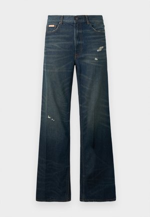 Jeans cu picioare late, din denim închis, cu estompare ușoară și zone uzate. Include un sistem de închidere cu buton și un design clasic cu cinci buzunare.