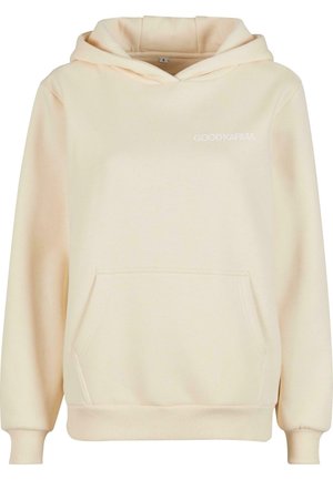 Hoodie de culoare crem, fabricat dintr-un material moale, având un buzunar tip kangaroo și mâneci cu manșetă. Are inscripția "GOODKARMA" imprimată în alb pe față.
