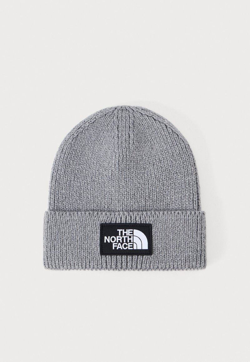 Gray knit beanie with a folded cuff, featuring a black rectangular logo patch displaying "THE NORTH FACE" in white text.