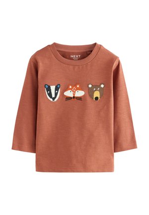 Rustfarbenes langärmliges Shirt mit gestickten Tiergesichtern: Dachs, Fuchs und Bär. Weiches Baumwollmaterial mit Rundhalsausschnitt.