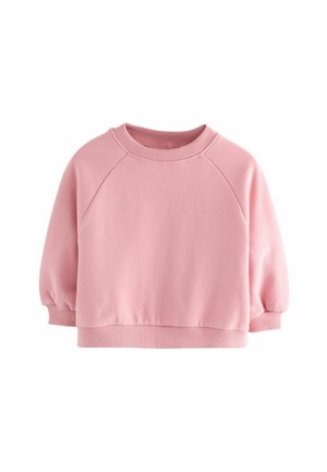 Sweat-shirt rose court avec encolure ronde, manches raglan et poignets côtelés. Confectionné dans un tissu doux au toucher lisse.