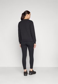 Champion GYM LIFESTYLE 7/8 LEGGINGS - Tajice - black