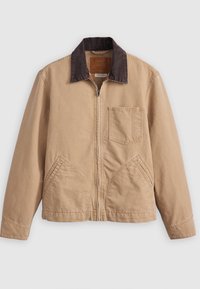 Beige bunda na zip s tmavě hnědým manžetovým límcem, třemi předními kapsami a dlouhými rukávy, vystavená na bílém pozadí.