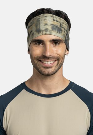 Cinta para la cabeza en una paleta de colores terrosos apagados con un patrón abstracto. Hecha de tela suave y elástica, se ajusta cómodamente alrededor de la cabeza.