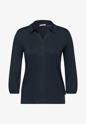 Marineblauwe lange mouwen polo met een V-hals, zachte stof en lichtjes gerimpelde mouwen. Het label zegt "CECI."