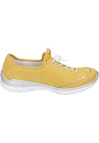 Yellow suede athletic shoe with white laces, a rounded toe, and a cushioned white sole. Features a silver accent along the sole and stitching.