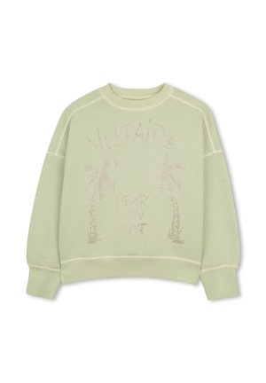 Sweat-shirt vert clair avec des palmiers en strass et le texte "Voltaire" au-dessus et "Heart on fire" en dessous.