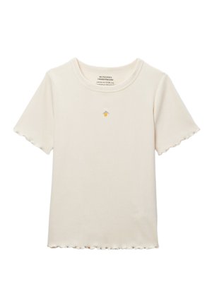T-shirt crème côtelé à manches courtes avec bords festonnés et petit citron jaune brodé avec des feuilles vertes au centre de la poitrine.