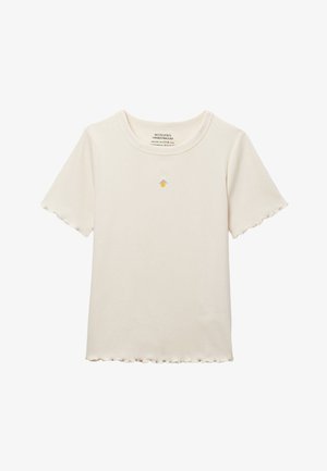T-shirt crème côtelé à manches courtes avec bords festonnés et petit citron jaune brodé avec des feuilles vertes au centre de la poitrine.