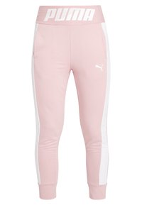 Ljusrosa joggers med vita sidstreck, elastisk midjeband med "PUMA"-logotyp och ribbade muddar. Tillverkade av mjukt, stretchigt material.