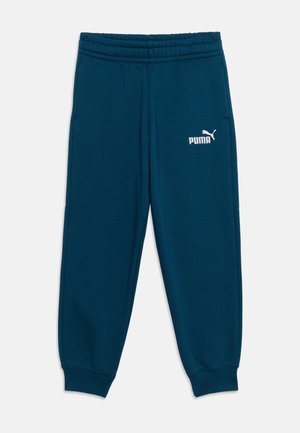 Mørkeblå Puma joggingbukser med elastik i talje og manchetter, med hvidt Puma-logo på øverste venstre lår.