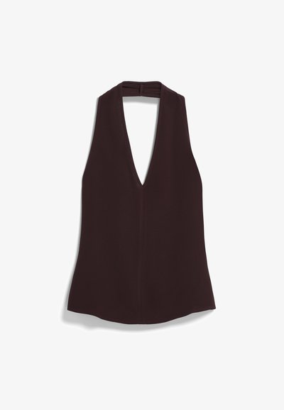 Beżowy halter top bez rękawów o głębokim dekolcie w kształcie V, wykonany z gładkiego materiału i z prostym dołem. Prosty design bez wzorów czy ozdób.