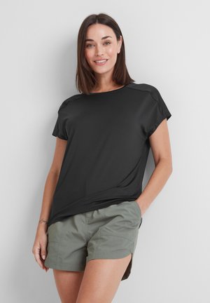 Black short-sleeve t-shirt with a loose fit, round neckline, and smooth texture, paired with olive green shorts.
