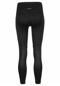 Leggings noirs avec une taille haute, une texture lisse et un design ajusté. Les accents notables incluent des panneaux latéraux dans des couleurs contrastées.