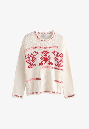 Tejelt, krémszínű pulóver, piros homár mintákkal, bordázott, kerek nyakkivágással, és kontrasztos piros varrással az ujjak végén és az alsó szegélyen.