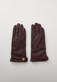 Burgunderfargede skinnhansker med en glatt tekstur, har dekorativ stitching langs siden og et gullaccent på mansjetten.
