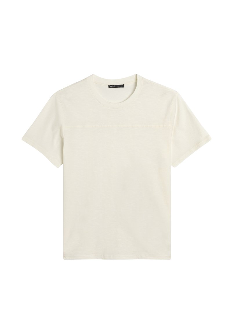 T-shirt a maniche corte, colletto tondo in un bianco sporco, realizzato in tessuto morbido con una superficie liscia e una cucitura orizzontale sul petto.
