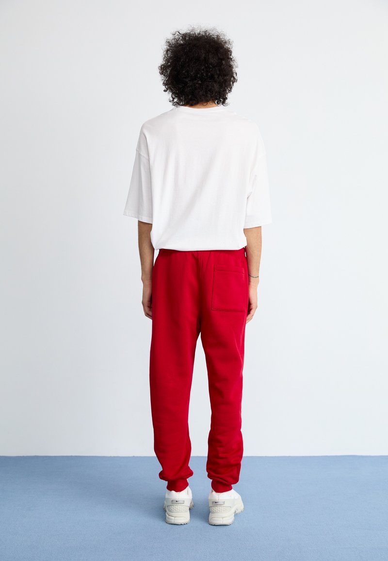 Jordan JUMPMAN PANT - Teplákové kalhoty - gym red/white