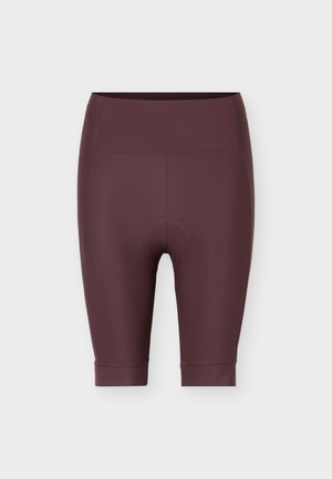 Korkeavyötäröiset, ruskeat pehmustetut pyöräilyshortsit, joissa on polven mittaiset lahkeet ja litteät saumat, suunniteltu mukavuuteen ja suorituskykyyn.