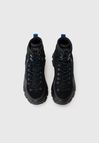 Black high-top hiking boots featuring mesh and suede materials, blue laces, and a rugged rubber sole for traction.