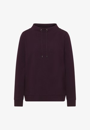 Vaaleanpunainen huppari, jossa on korkea kaula-aukko, nyörit yksityiskohtina ja pitkät hihat. Valmistettu pehmeästä, teksturoidusta kankaasta.