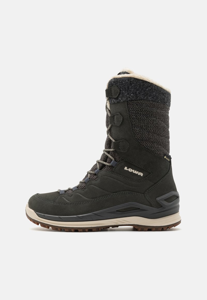 Black waterproof hiking boot with a textured knit upper, faux fur collar, gray laces, and brown rubber sole for enhanced traction.