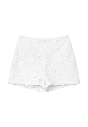 Hvide blonde shorts med blomsterudskårne mønstre, der har indviklet broderi og en tætsiddende talje.