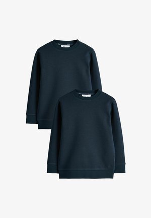 Twee effen donker marineblauwe crewneck sweatshirts met lange mouwen, geribde boordjes aan mouwen en taille, getoond op een witte achtergrond.