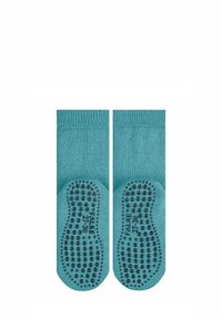 Türkise Kindersocken mit rutschfesten, strukturierten Sohlen, gerippten Bündchen und glatter Stoffoberfläche; Größenangaben auf den Sohlen sichtbar.