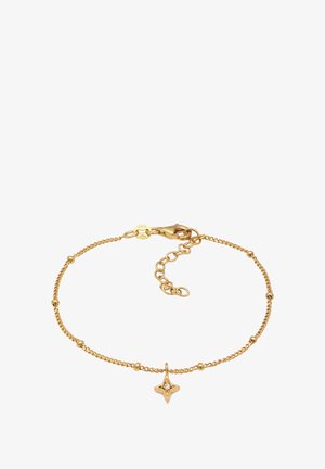 Guldkedja armband med små runda pärlor och en stjärnformad hängsmycke med en central ädelsten. Karbinlås med justerbar längd.