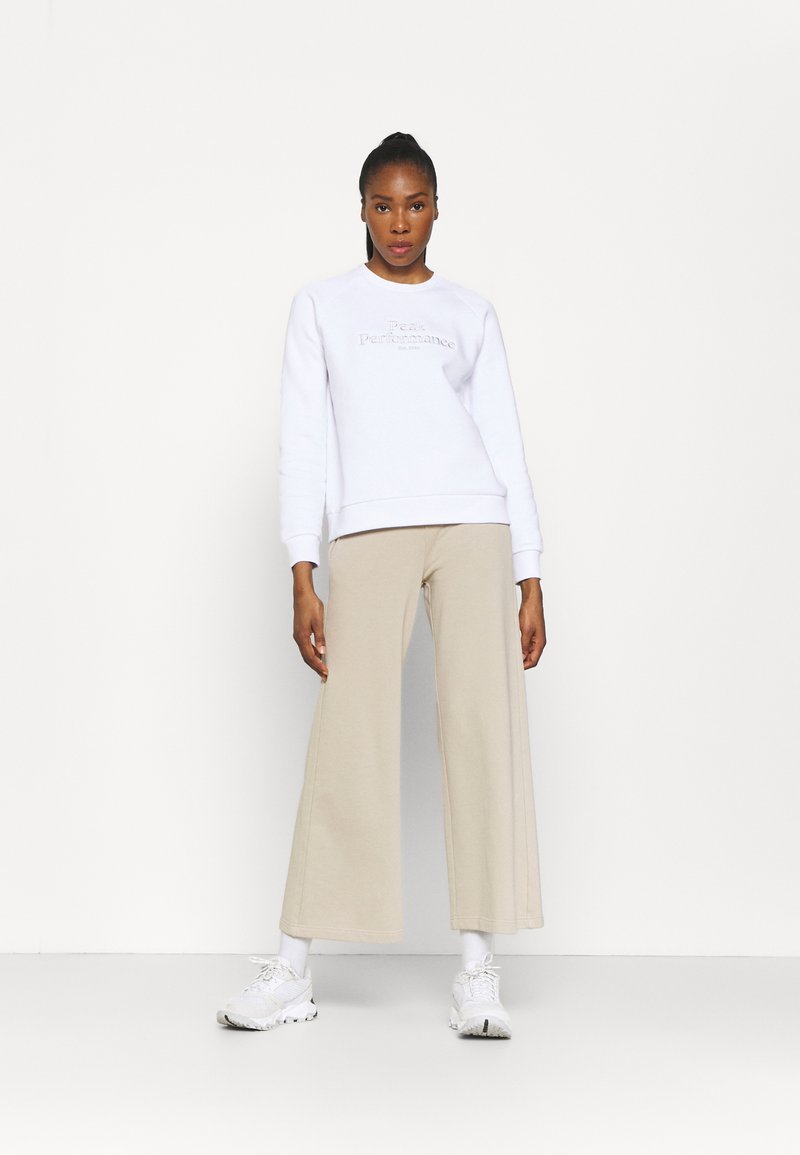 Damen Sportbekleidung | Peak Performance ORIGINAL LIGHT WIDE Stoffhose celsian beige/beige - EO90592 Damen Sportbekleidung | Peak Performance ORIGINAL LIGHT WIDE Stoffhose celsian beige/beige - EO90592