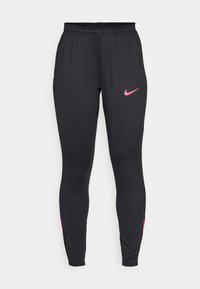 STRIKE - Tracksuit bottoms - black/hyper pink