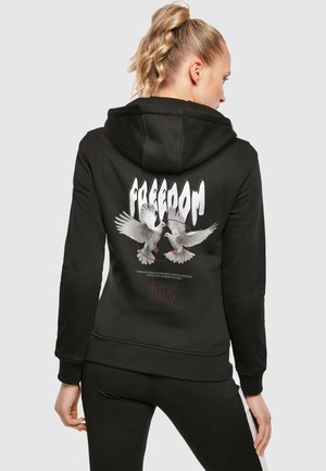 Black hoodie featuring a graphic of two white doves on the back, surrounded by the word "FREEDOM" in bold font. Soft fabric, adjustable hood.